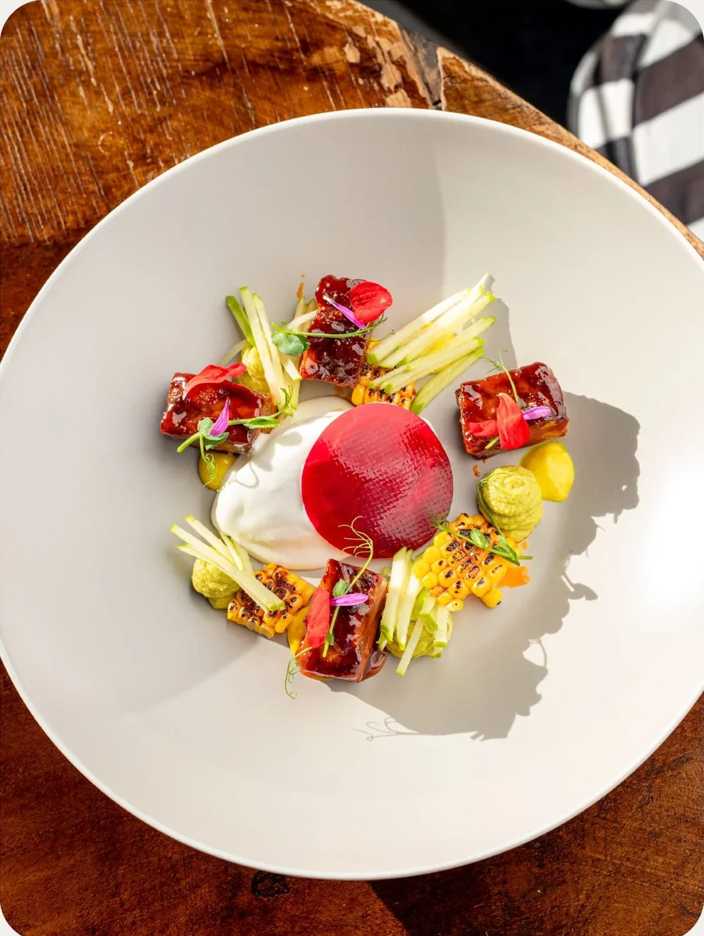 An Ate dish with colourful vegetables and carefully layered textures